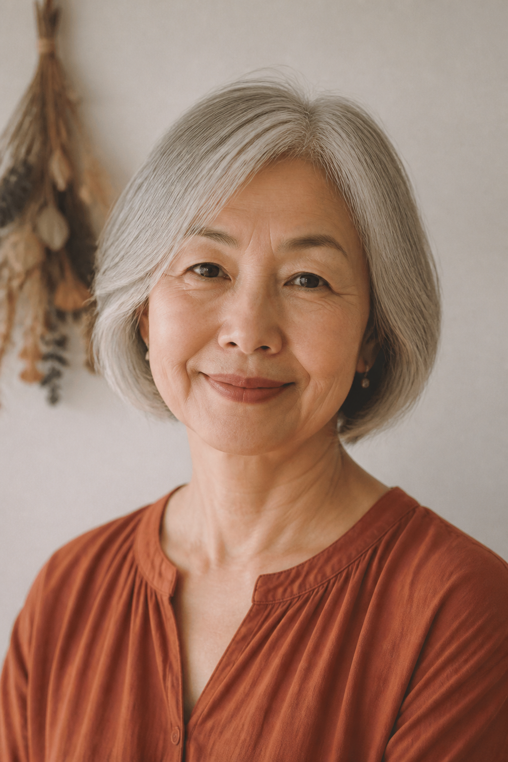 Portrait of an older woman with a silver bob.
